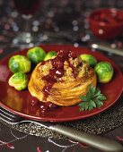 Vegetarian filled puff pastry with cranberry sauce