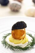Crumb-coated fried boiled egg with caviar