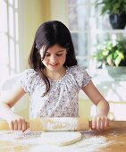 Girl rolling out pastry