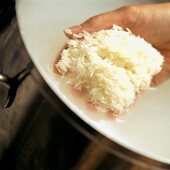 A Handful of Rice Being Rinsed