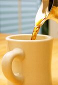 Pouring Coffee into a Mug