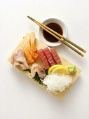 A Sushi Assortment with Sauce and Chopsticks