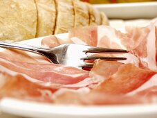 Sliced Procuitto on Plate with Fork
