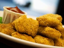 Chicken Nuggets on a Plate with Ketchup