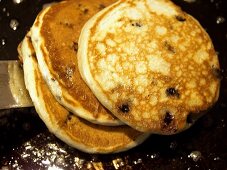 Removing Three Blueberry Pancakes off the Grill