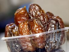 Wrapped Dates in a Plastic Container