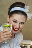 A retro-style girl holding a glass of lemonade