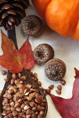 Roasted Kasha in a Wooden Spoon; Autumn Leaves, Acorns and Pumpkin