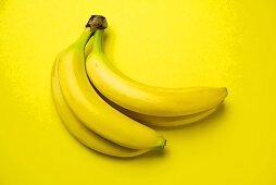 Bunch of Bananas on a Yellow Background