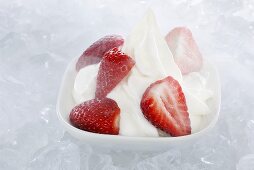 Yogurt ice cream, garnished with fresh strawberries