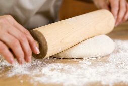 Woman Rolling Out Dough with a Rolling Pin