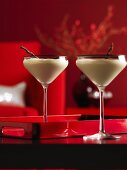 Two cream cocktails in Martini glasses