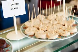 Boudin blanc in slices on a market stall