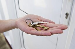 A person holding keys