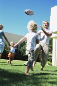 Family playing in garden