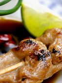 Thai chicken kebab in soy and chili sauce; lime