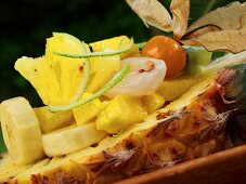 Exotic fruit salad in half a pineapple