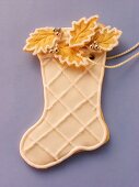 Decorated sweet pastry biscuit (boot) as tree ornament