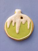 Green & white decorated biscuit as Christmas bauble