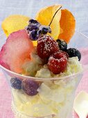 Quark dessert with berries and candied flowers