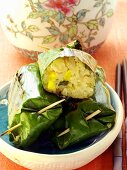 Asian rice parcels in banana leaf