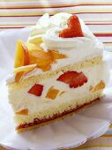 A piece of summery fruit gateau with cream