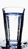 Glass of mineral water in blue