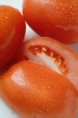 Plum tomatoes with drops of water (detail)