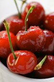 Fresh red cherries with drops of water