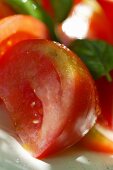 Tomatoes with fresh basil (detail)