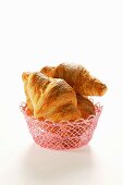 Croissants in pink bread basket