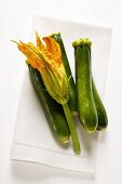 Courgette and courgette flower on napkin