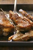 Crispy roast turkey pieces on baking tray