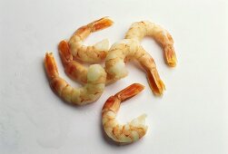 Several cooked, peeled shrimps