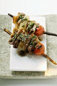 Barbecued pork kebabs with cherry tomatoes