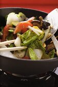 Asian vegetables with mushrooms in wok