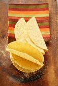 Taco shells in front of striped cloth
