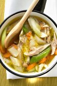 Chicken soup with vegetables in saucepan