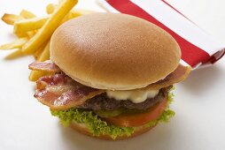 Hamburger with bacon and chips