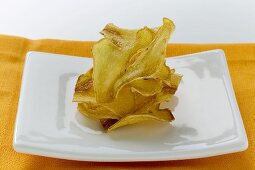 Deep-fried ginger slices on plate