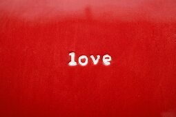 The word Love on red plate (close-up)