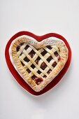 Cherry pie on heart-shaped plate