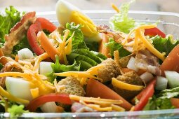Salad leaves with vegetables, egg, cheese & bacon to take away