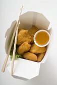 Chicken Nuggets with sweet and sour sauce to take away