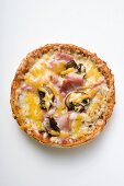 Mini-pizza with ham, mushrooms and cheese