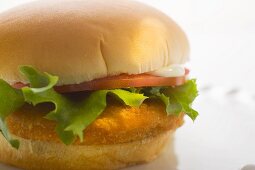 Chicken burger with tomato, mayonnaise and lettuce