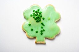 Shamrock biscuit with green icing for St. Patrick's Day