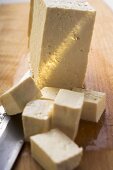 Block of tofu, diced tofu and Asian knife