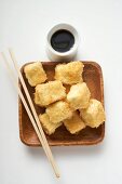 Breaded tofu cubes with soy sauce (Asia)