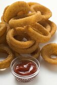 Deep-fried onion rings with ketchup